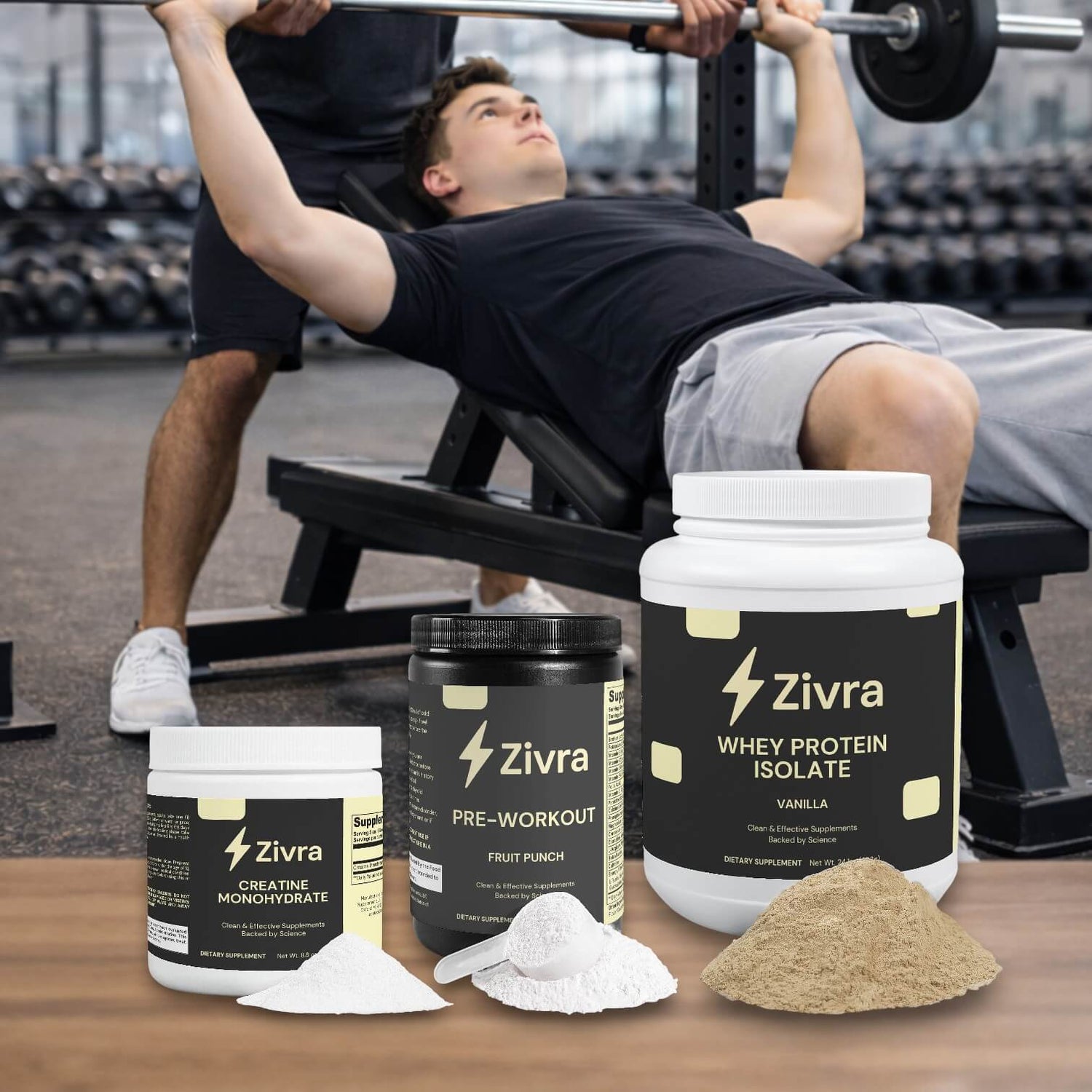 Person lifting weights in a gym with Zivra supplement containers in the foreground.
